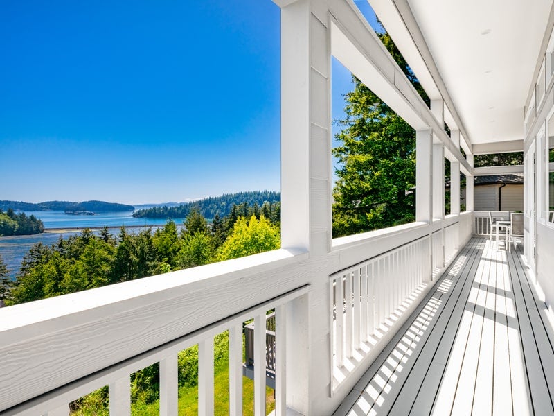 View of Lake Whatcom from white porch during summer day